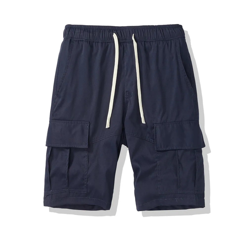 Man wearing loose-fitting black cropped trousers with multiple pockets, showcasing the Korean-style summer leisure design.