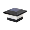 Compact solar garden LED landscape light with ground spike in garden setting
