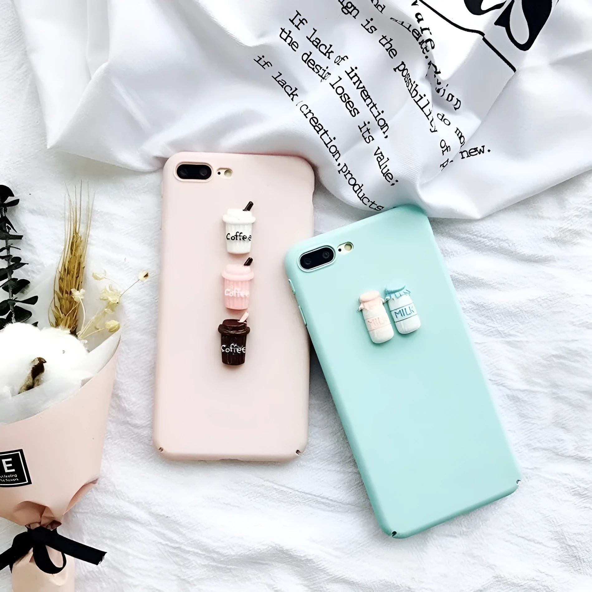 Soft silicone iPhone case with a raised 3D cartoon cat design, shown in pink.