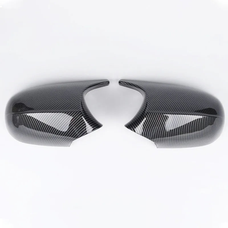 Pair of BMW 3 Series E90 ABS plastic rearview mirror housings in black and carbon pattern finishes