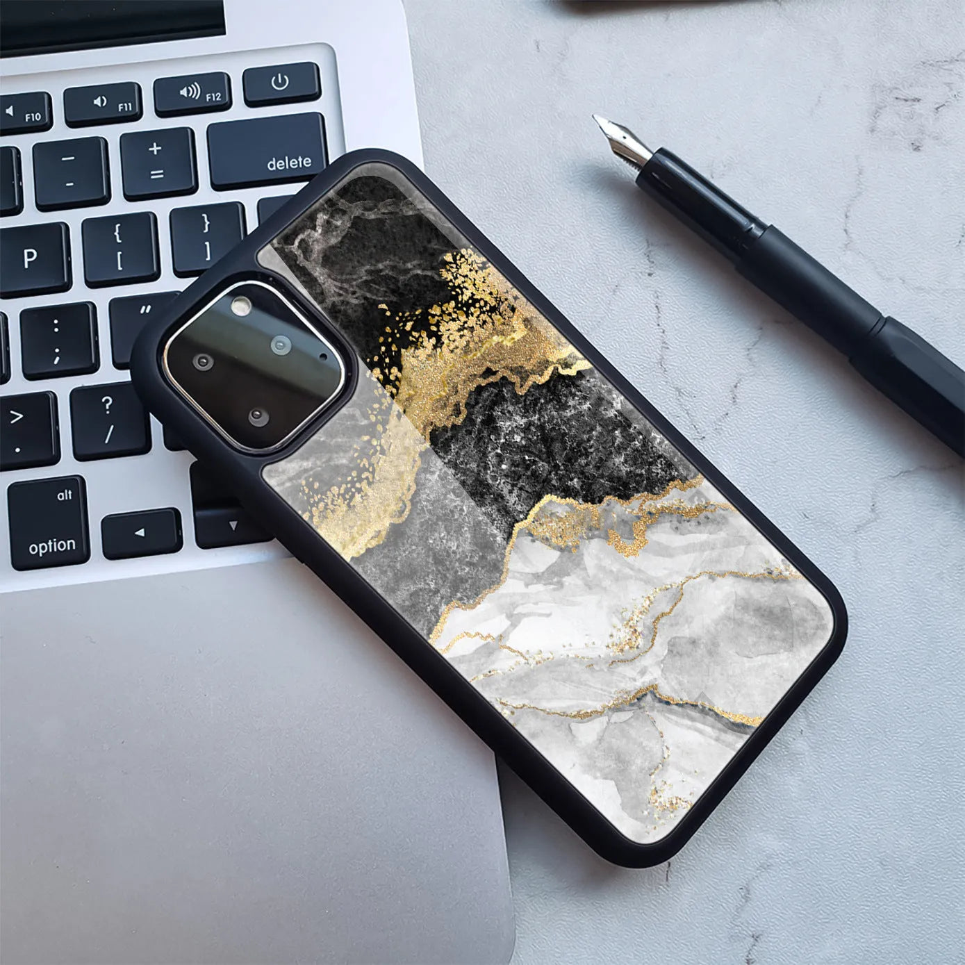 Samsung Galaxy phone case with marbled pattern in blue and gold colour variation