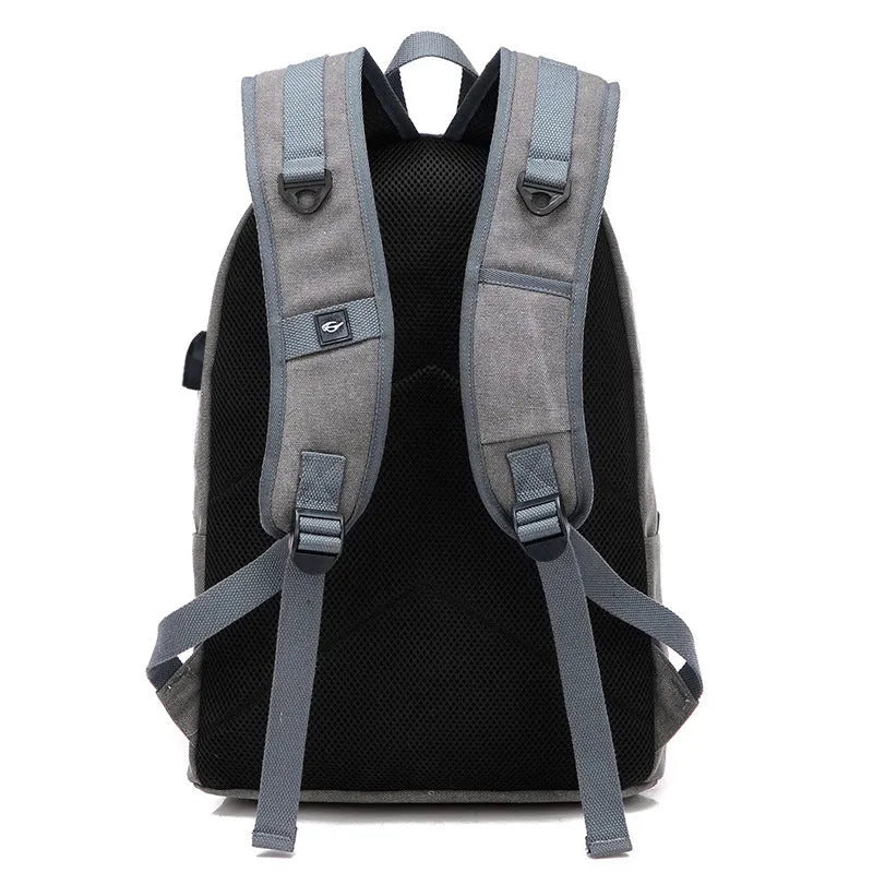 Canvas backpack with USB charging port in grey colour showing multiple compartments