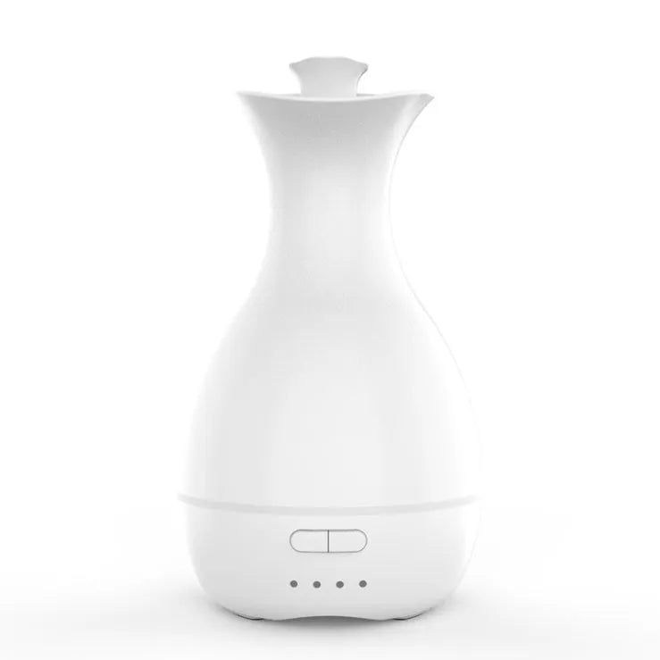 White or pink ultrasonic essential oil diffuser with 200ml tank, night light, and control buttons.