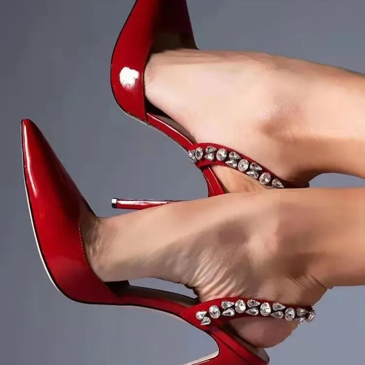 Pointed toe high heel sandals with rhinestone decoration on the side, shown in patent leather red with an 11cm heel.