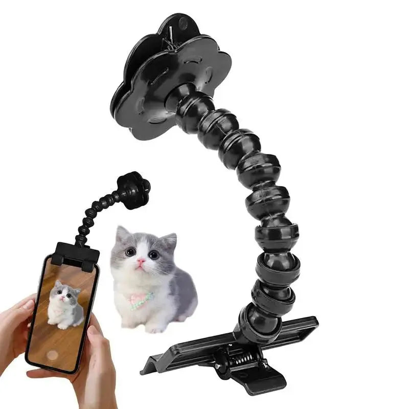 Black pet photography clip with rotating treat holder attached to mobile phone