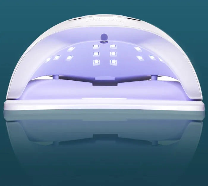 White nail polish drying lamp with dual UV and LED light sources for gel polish curing