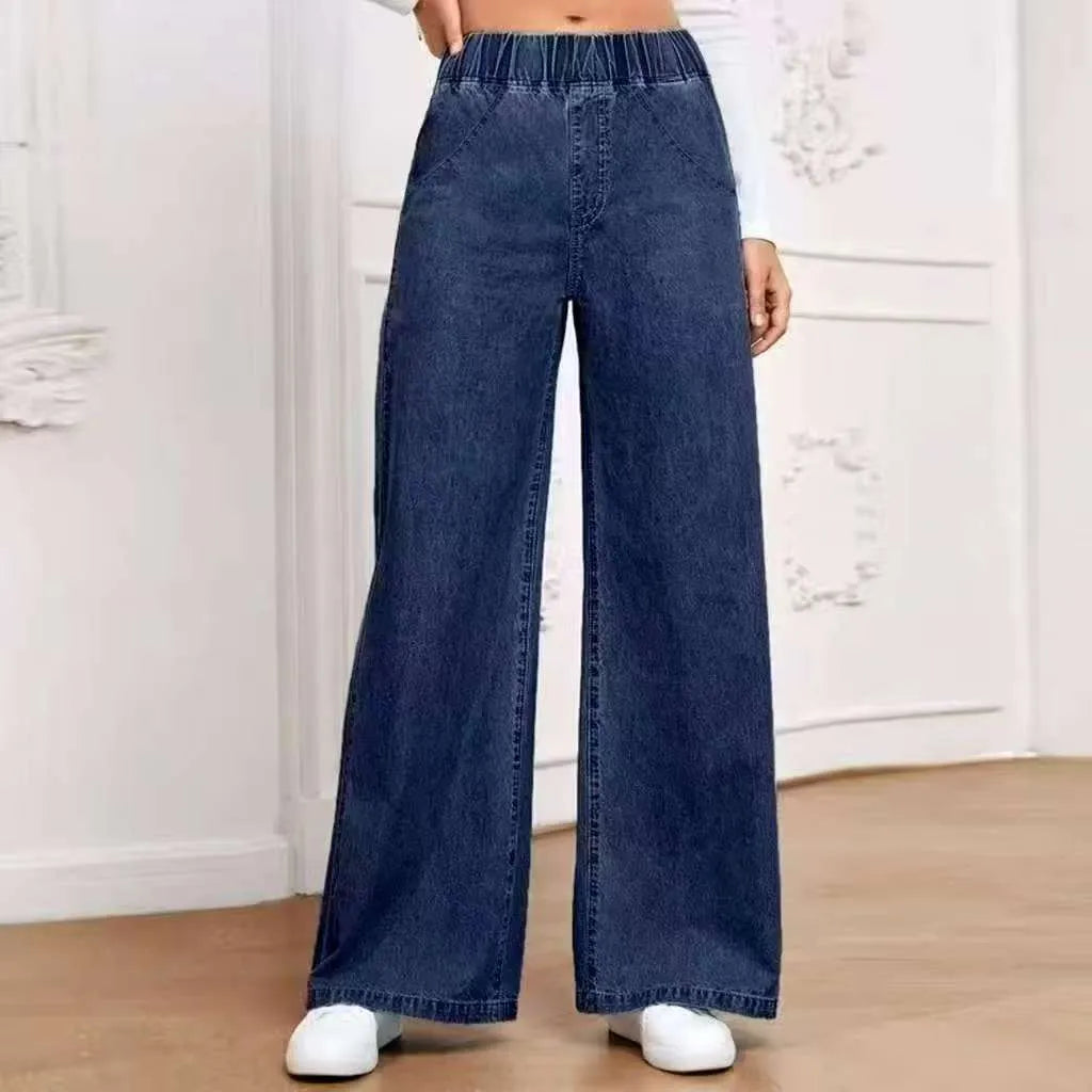 Plus size light blue washed straight leg jeans with wide fit and mid waist design