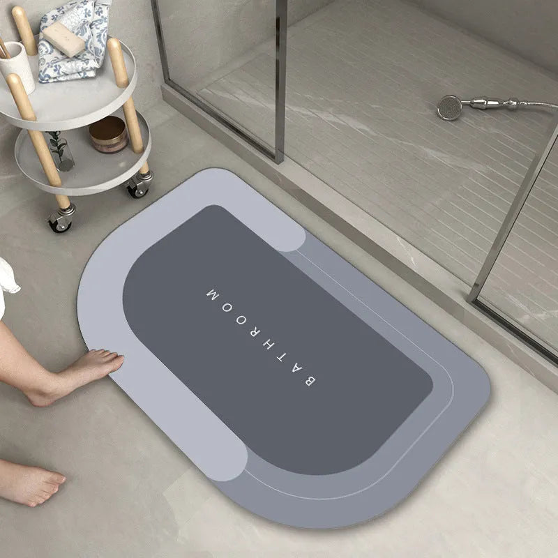 Blended material floor mat in blue colour with oval shape on bathroom floor