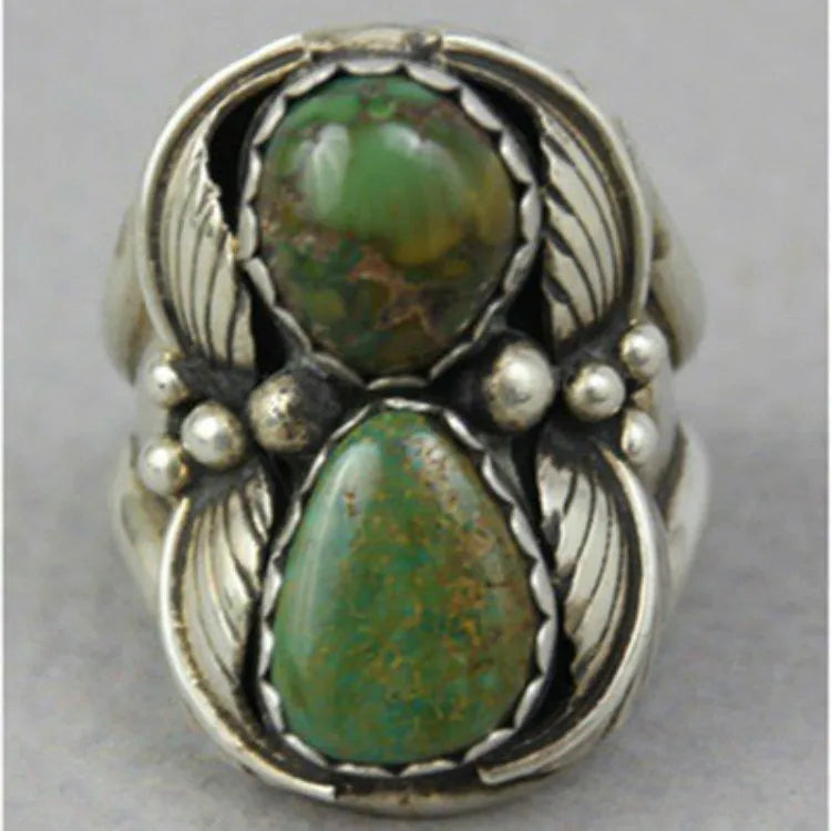 Women's turquoise geometric alloy ring with inlaid retro design, shown on a finger.