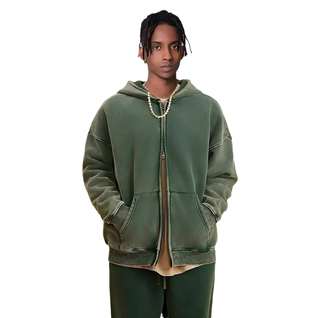 Man wearing a vintage wash fleece-lined hooded cardigan with a double zipper, shown in dark green.