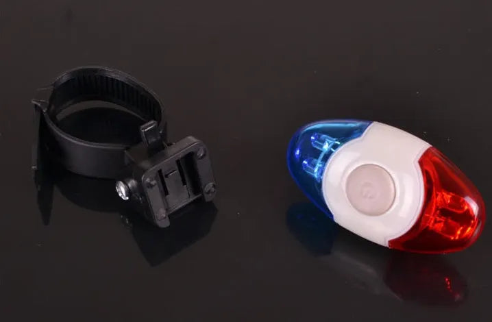 Red and blue LED bicycle tail light with adjustable mounting bracket.