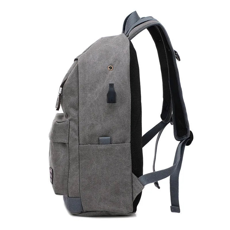 Canvas backpack with USB charging port in grey colour showing multiple compartments