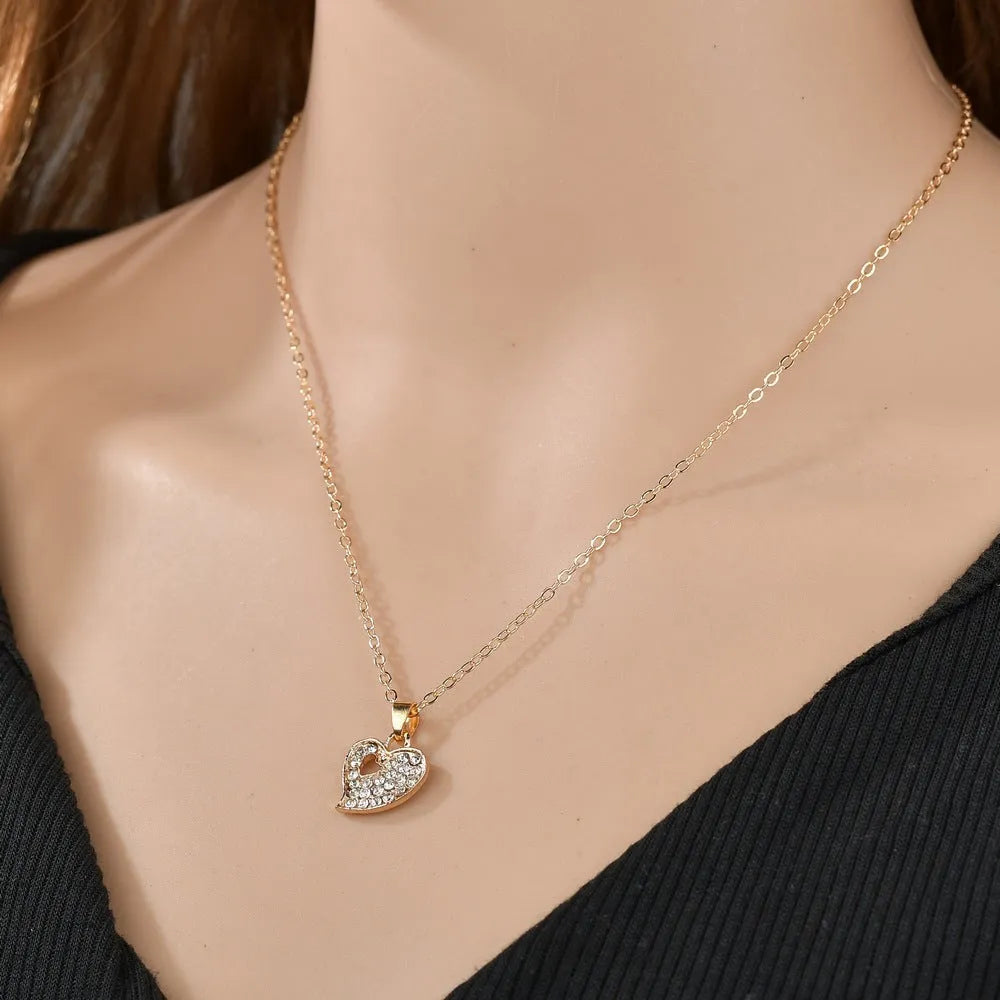 Gold electroplated love jewellery set with adjustable pendant, earrings, and hand decorations for women