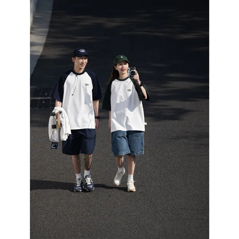 Men's loose blue raglan sleeve T-shirt made from thin polyester blend fabric.