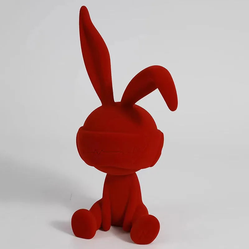 Suede blindfold rabbit resin table ornament in green, blue, or red colour options.