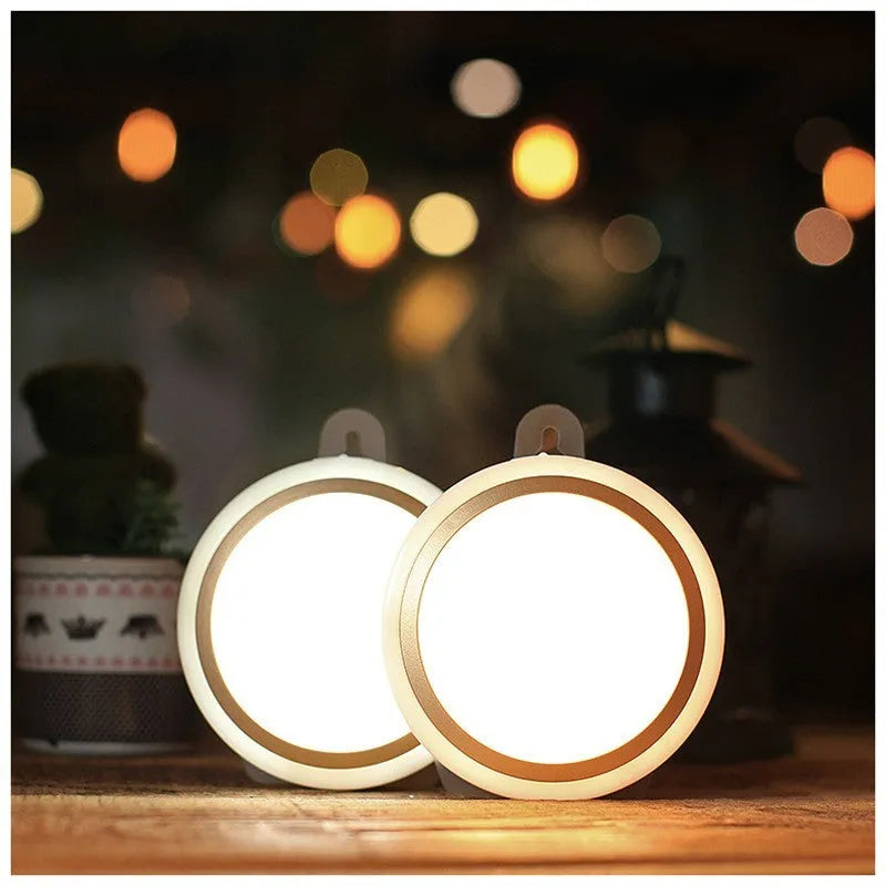 Compact circular white motion sensor LED light with a diameter of 80mm, suitable for wardrobe or corridor mounting.