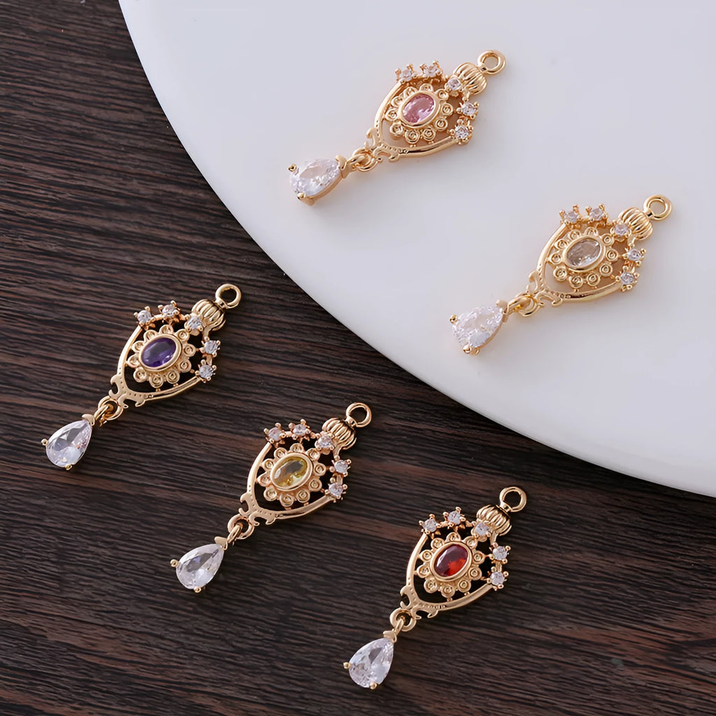 Copper crown-shaped hollow water drop pendant with micro inlaid zircon in five colour options.