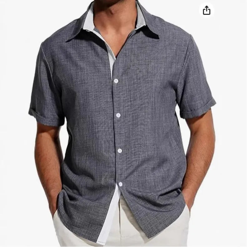Men's short-sleeved floral print polyester shirt in grey on a hanger.