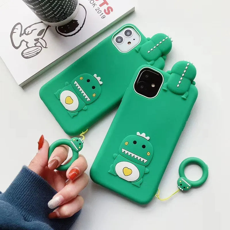 Green and yellow silicone phone cases with cartoon animal designs for Apple iPhones.