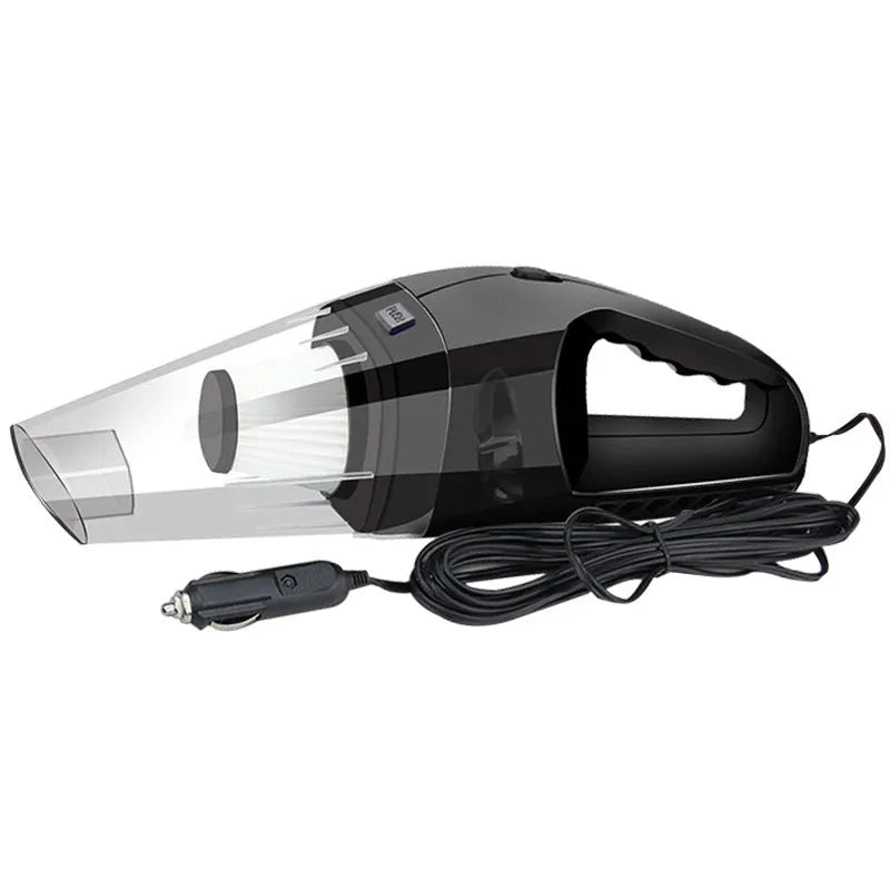 Compact orange handheld vacuum cleaner with nozzle, next to a car's 12V cigarette lighter socket.