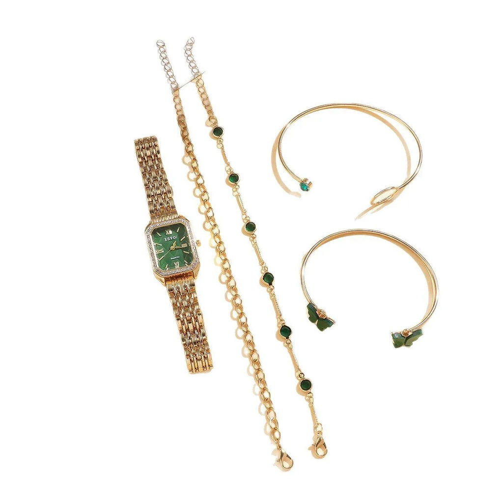 Gold green square steel ladies watch and four matching butterfly jewellery bracelets laid out as a set.