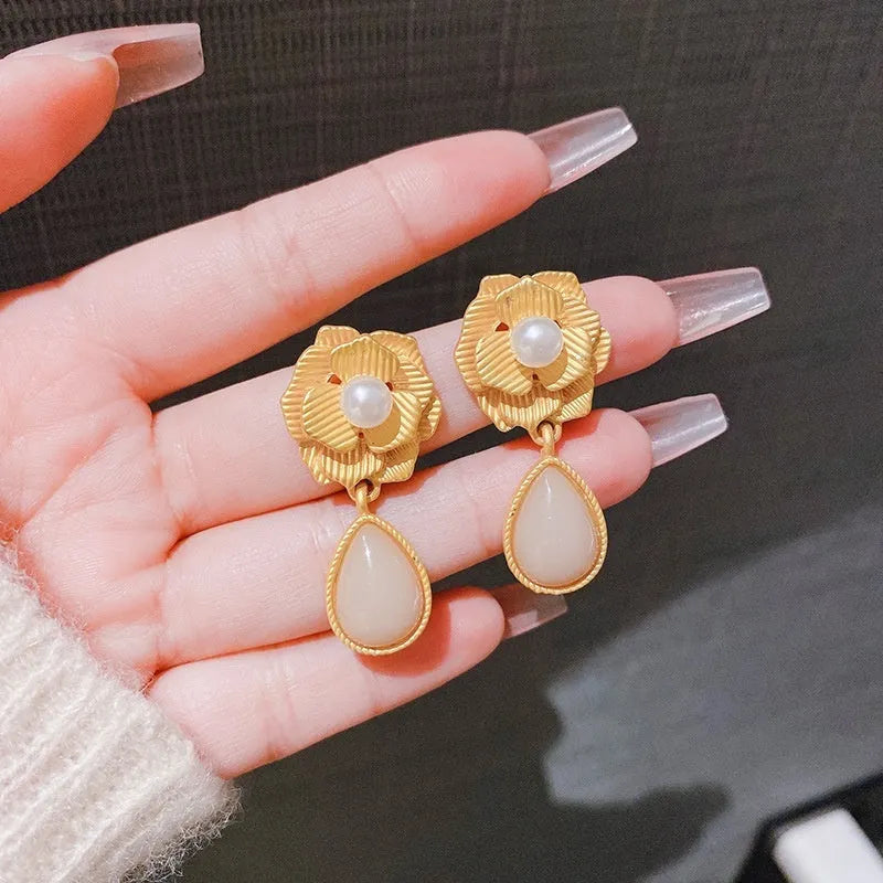 Gold coloured flower stud earrings with opal stone and ice flower design on silver electroplated alloy