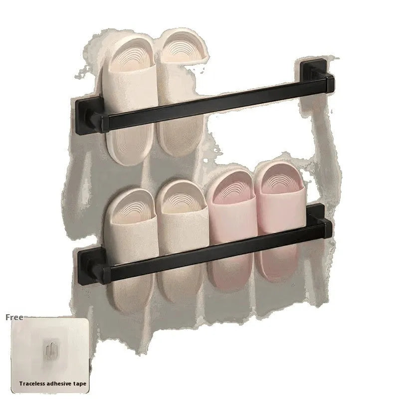Black wall-mounted bathroom slipper rack with a small integrated seat, showing adhesive backing for punch-free installation.