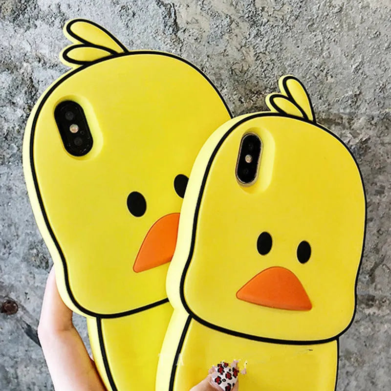 Green and yellow silicone phone cases with cartoon animal designs for Apple iPhones.