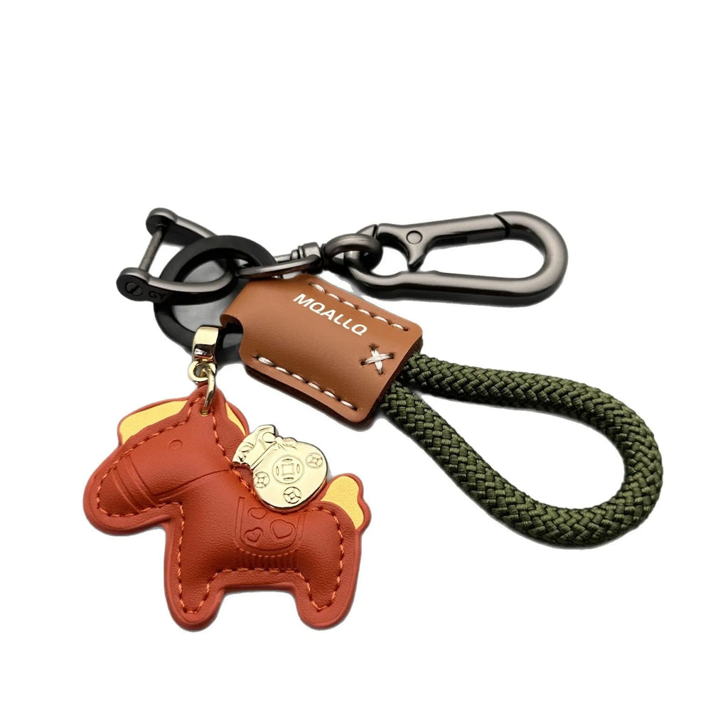 Handmade zinc alloy cowhide car key pendant on a flannel rope strap in various colour options.
