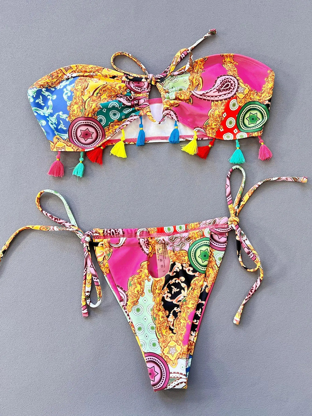 Women's printed separated swimwear bikini set with tube top and briefs.