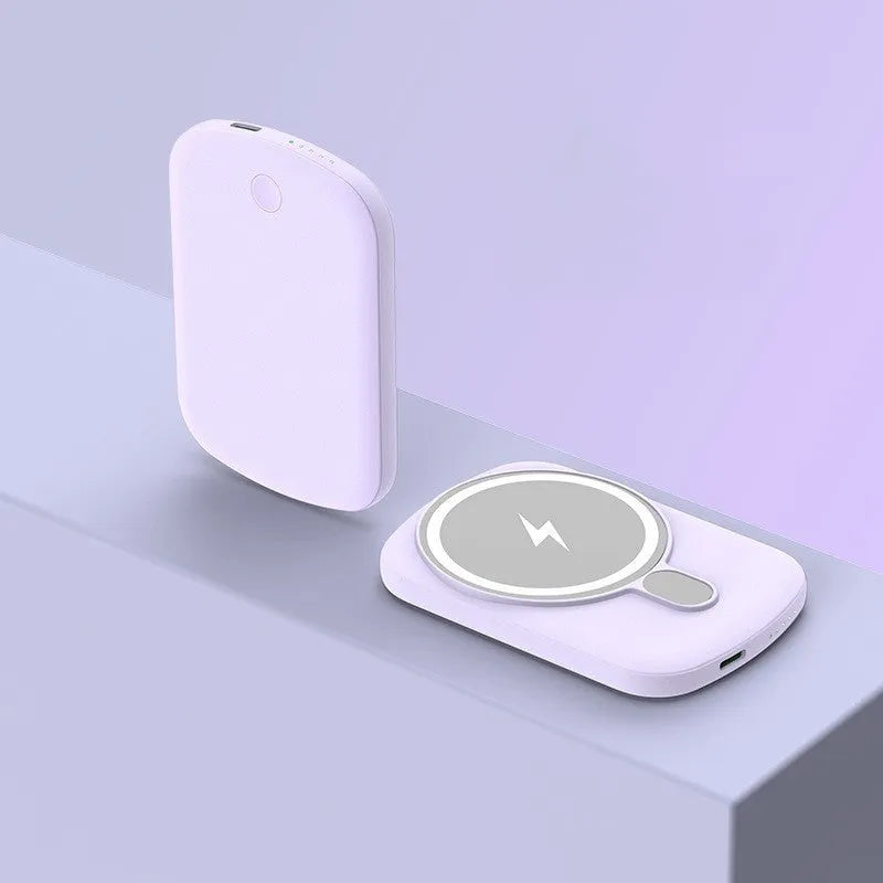 Magsafe magnetic wireless power bank in four colours: black, purple, pink, and white, next to an iPhone.