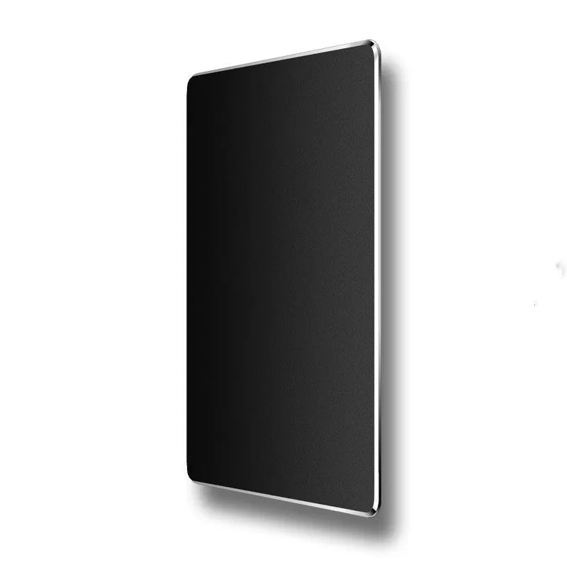 Double-sided aluminium mouse pad in Black on a desk, showing non-slip metal surface and compact size