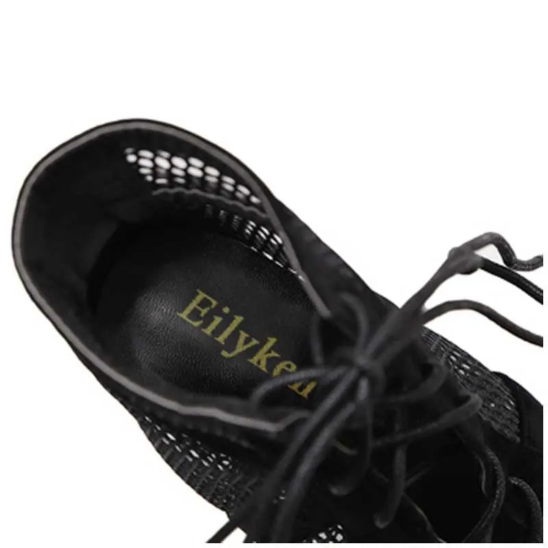 Black suede women's lace-up high heel shoes with 11.5cm heel on a plain background