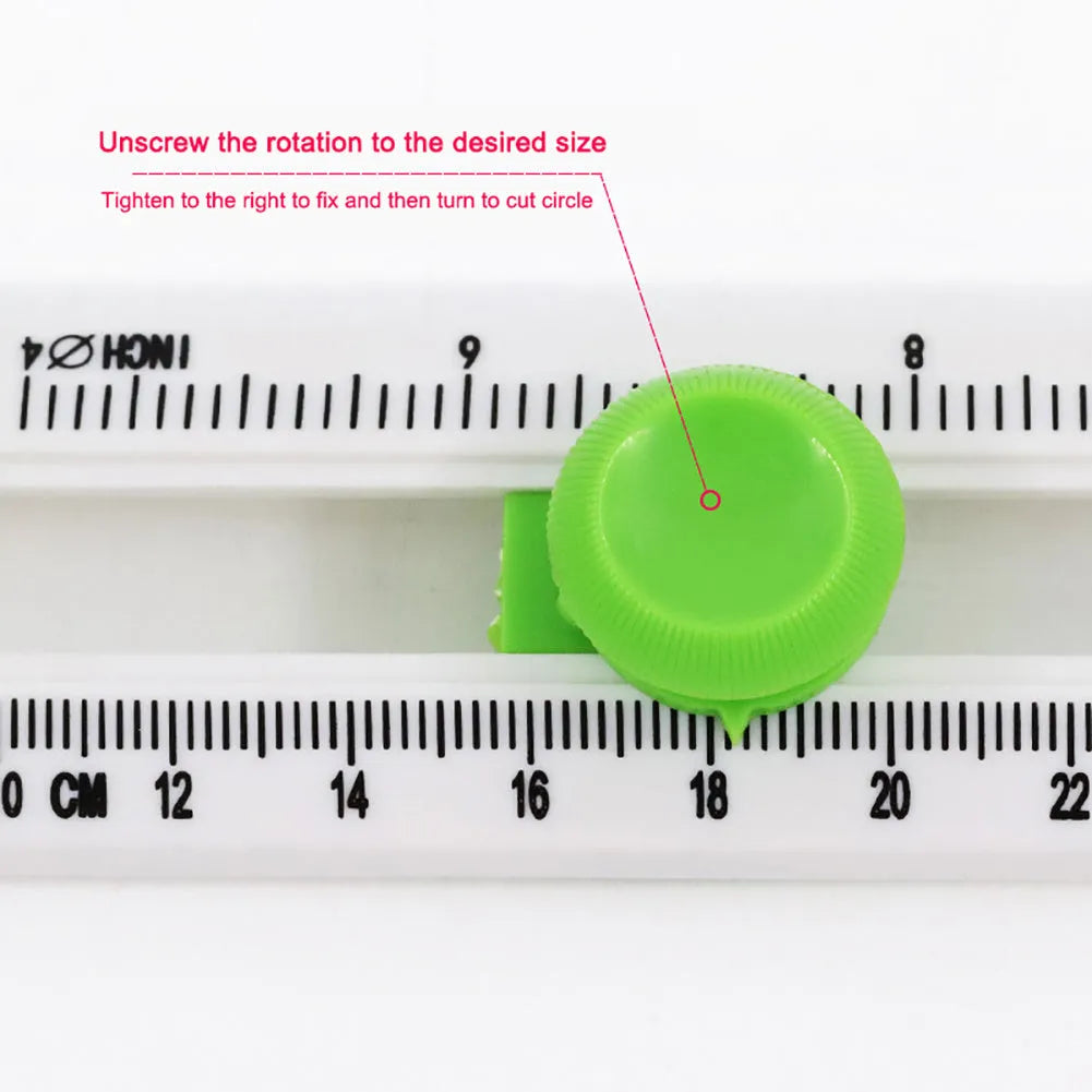 Orange or green plastic round paper cutter for A3 sheets on a colour box.