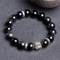Obsidian and 999 silver bracelet with natural cloud pattern beads, shown in 10mm and 12mm sizes.
