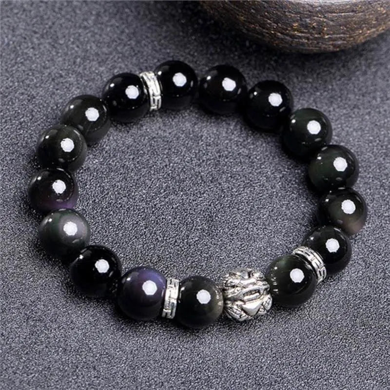 Obsidian and 999 silver bracelet with natural cloud pattern beads, shown in 10mm and 12mm sizes.