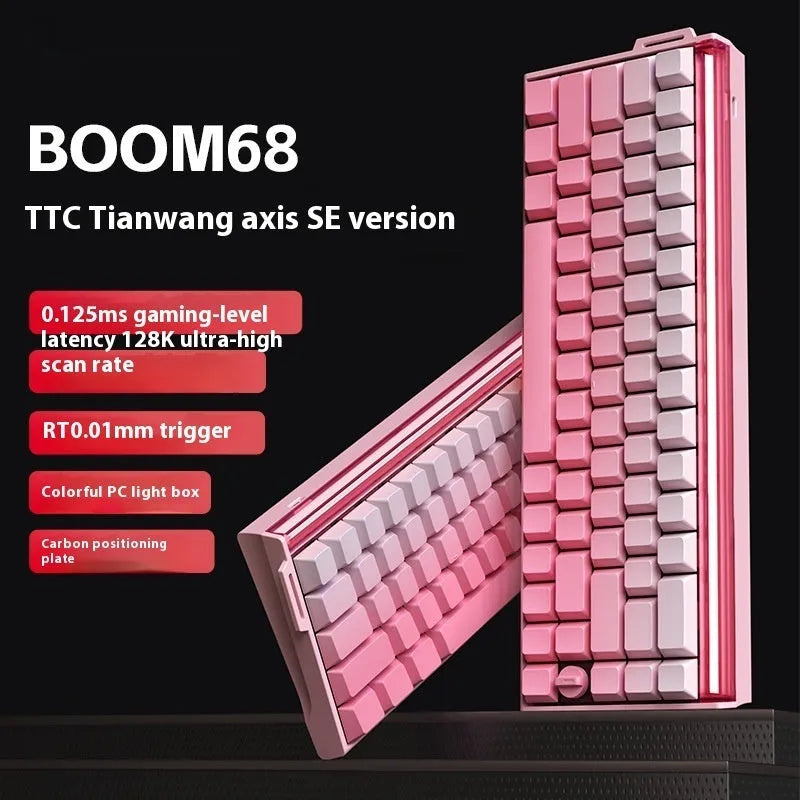 Boom68 compact mechanical gaming keyboard with RGB backlighting on a desk, showing its 68% layout and Gradient Pink colourway.