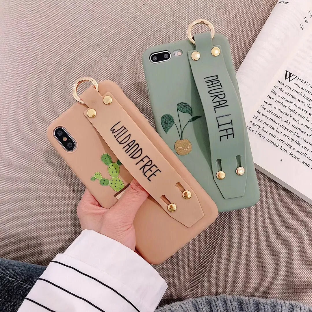 Green graffiti-style iPhone case with an integrated wristband holder on the back.