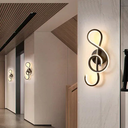 Nordic minimalist LED wall lamp with silicone shade in black finish mounted beside bed