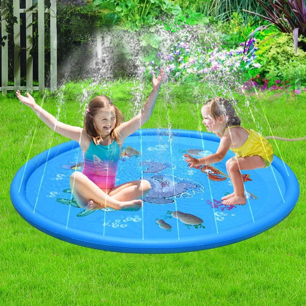 Blue PVC children's water spray play mat with marine animal prints, connected to a garden hose.