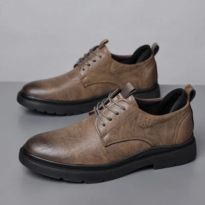 Men's black leather shoes with visible stitching on a two-layer cowhide upper and a rubber sole.