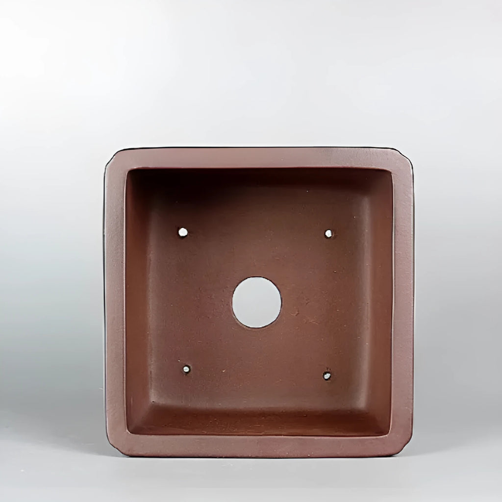 Brown handmade antique purple clay flower pot with classical design.