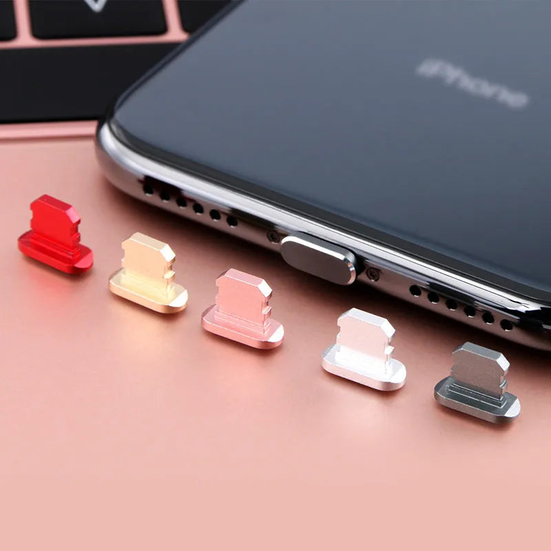 Aluminium alloy iPhone charging port dust plug shown in various colours including gold, silver, blue, and rose gold.