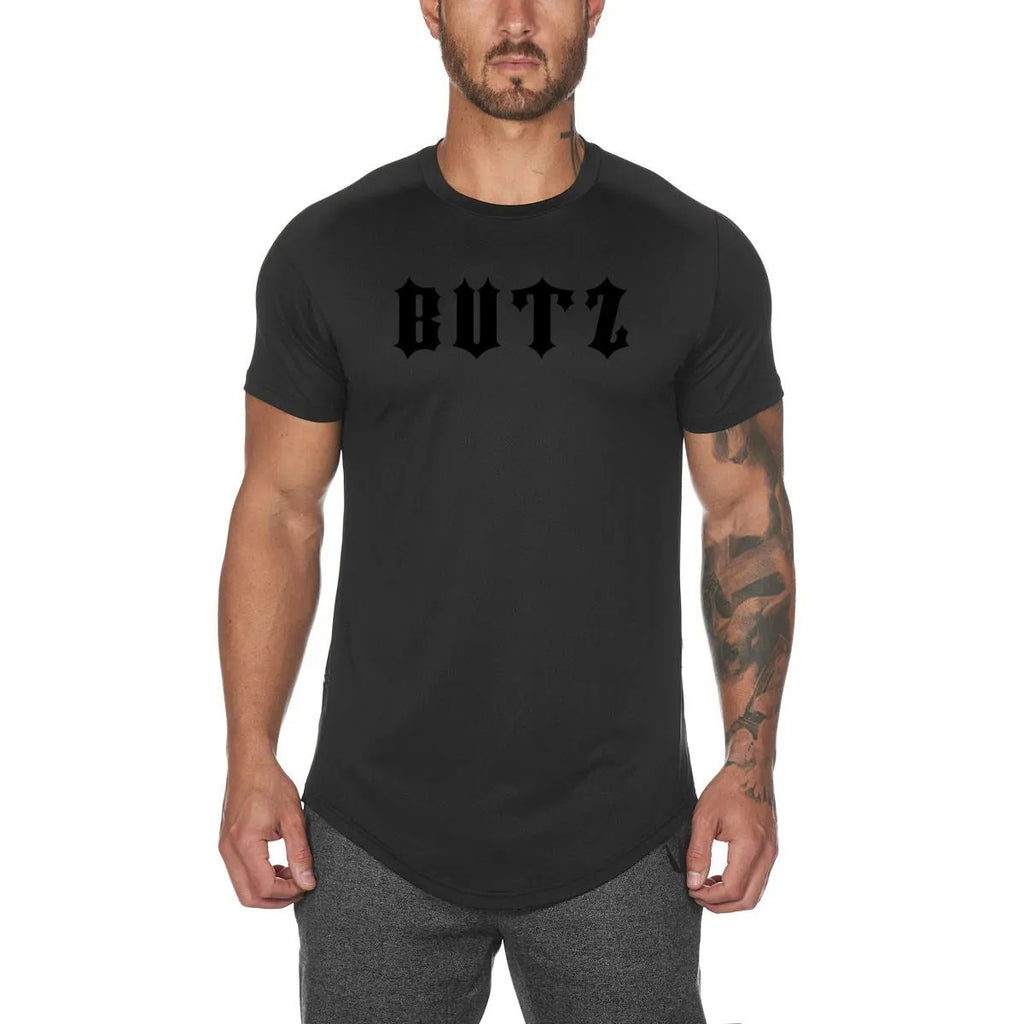A plain men's grey gym shirt made from cotton and spandex fabric on a hanger.