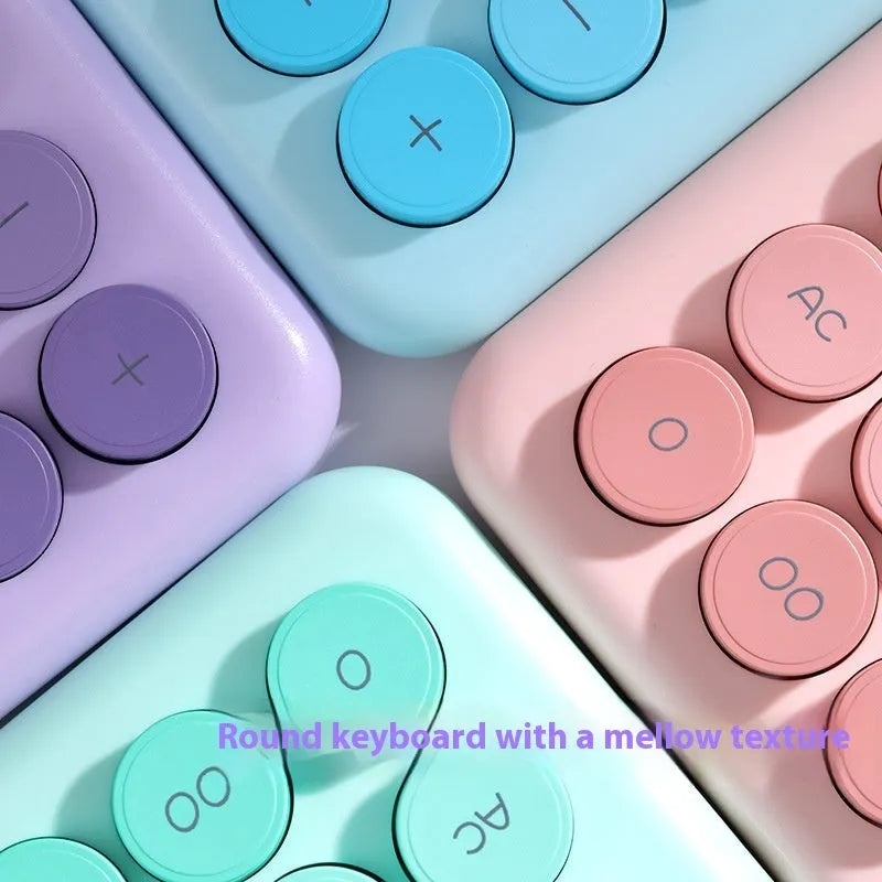 Desktop calculator with gradient colour options including violet, pink, blue and mint green