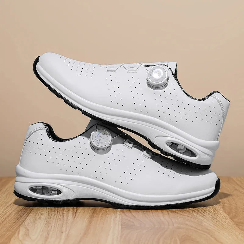 Black and white low top mesh tennis shoes with composite sole and cross shoulder straps