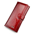 Women's red patent leather coin purse with a crocodile-embossed texture.