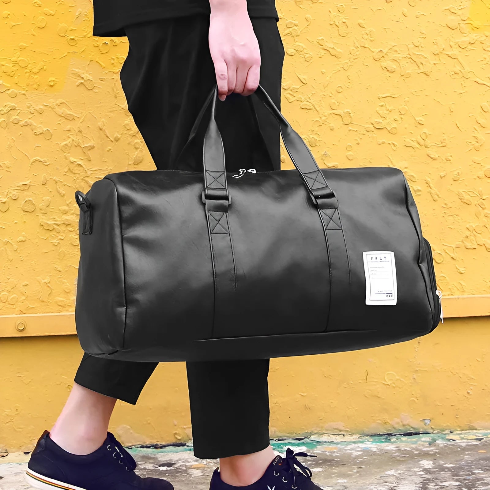 Black waterproof sports bag with diagonal straps and a separate shoe compartment, shown in large and small sizes.