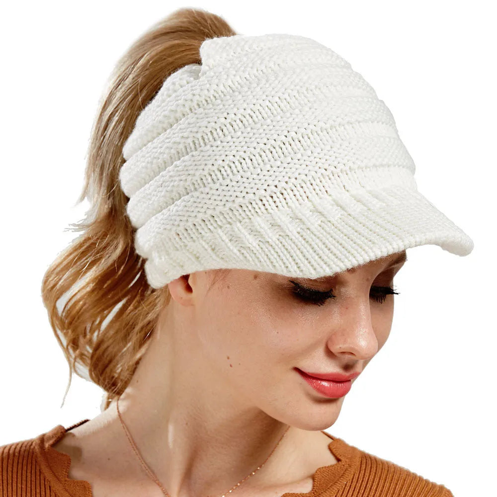 Women's soft acrylic ponytail beanie in light grey, showing the opening for a ponytail.