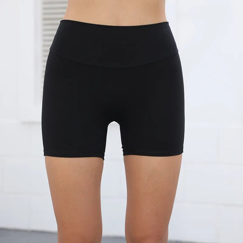 Women's high-waist fitness shorts with side pockets in quick-dry nylon fabric